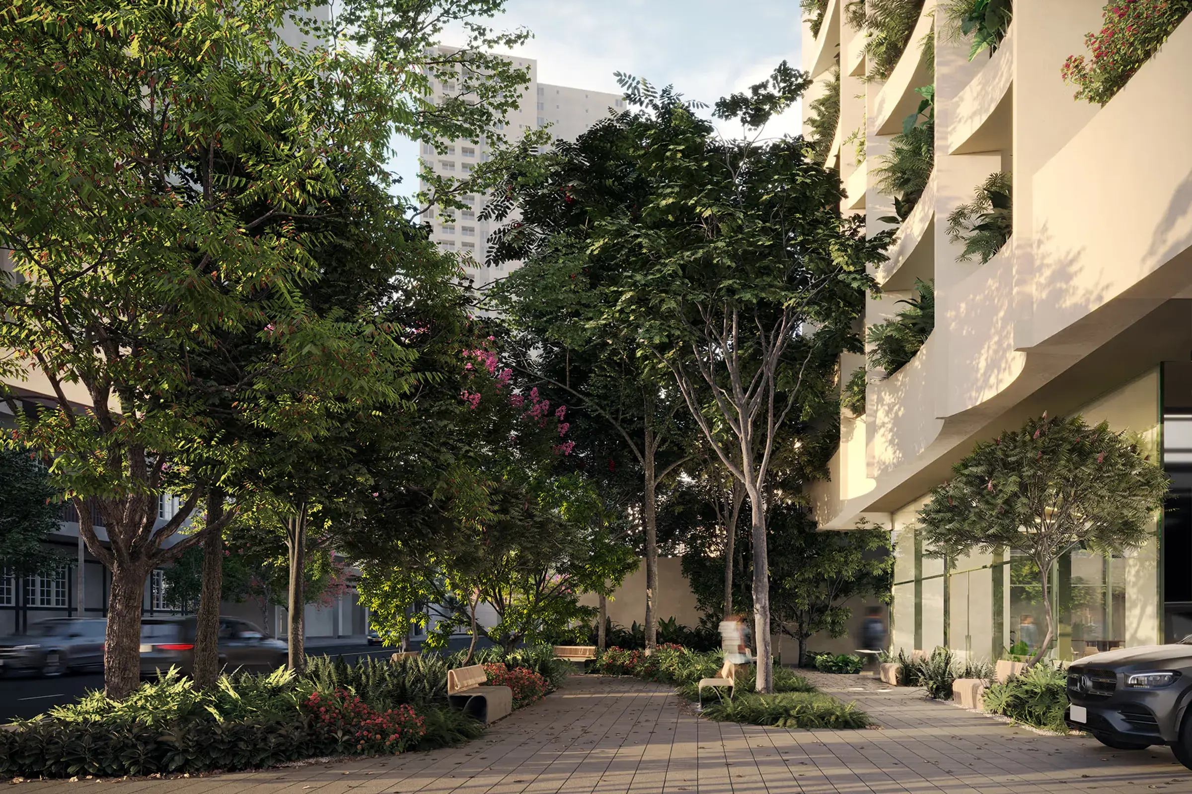Architectural render of a tree-lined pedestrian path with benches and flowering plants beside the A19 Cincuentenario building, whose curved balconies are planted with ferns.