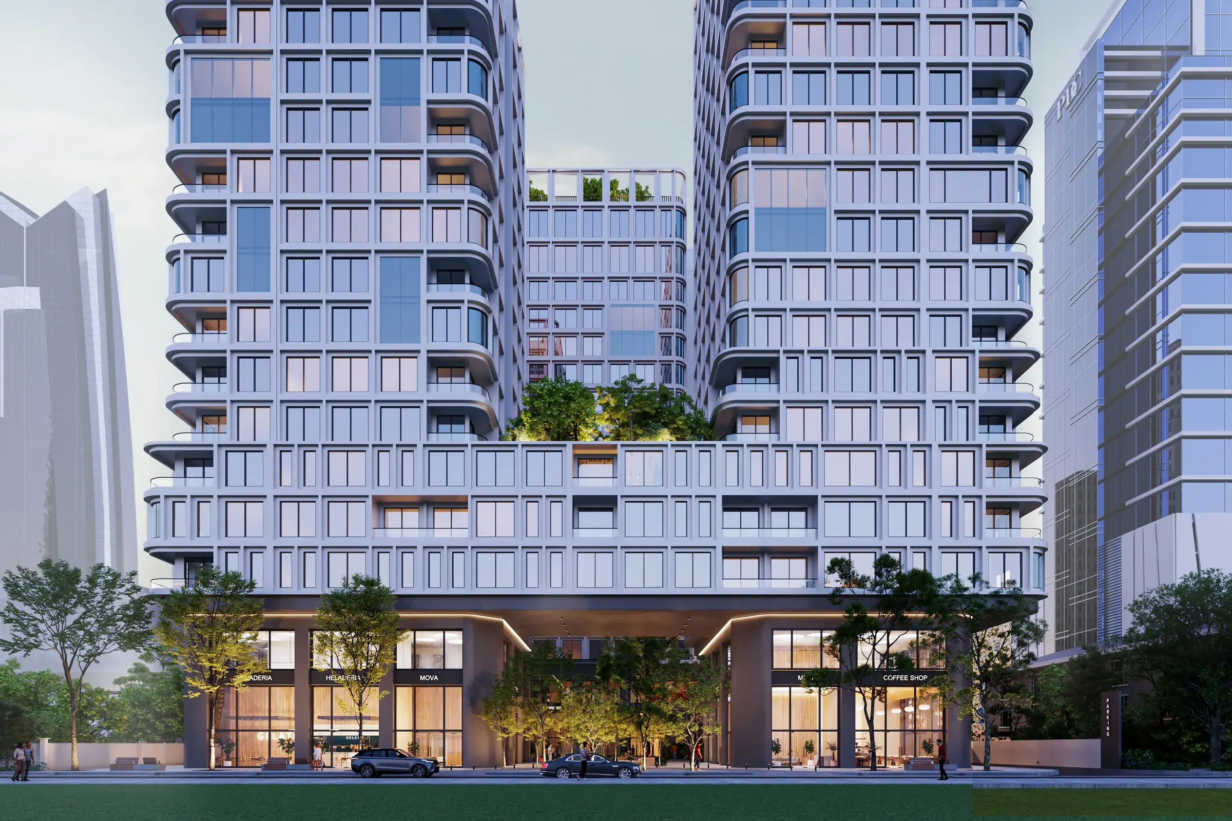 Architectural render of the MOVA Residences twin towers at dusk, with white gridded facades and curved balconies, a planted podium garden between them and shops at street level.