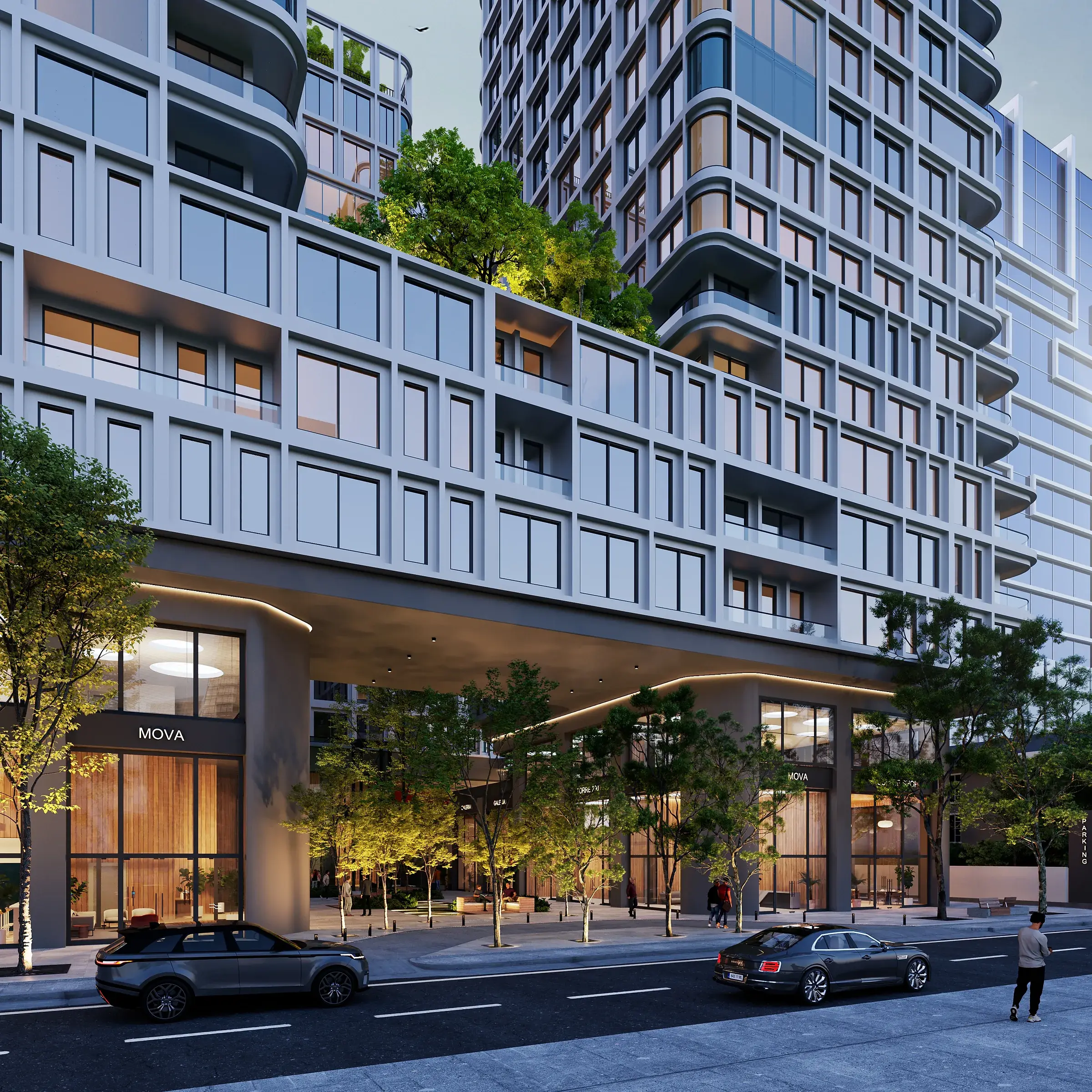 Architectural render of the MOVA Residences podium from the street at dusk, with a cantilevered covered entrance, a tree-filled plaza, lit shopfronts and a garden terrace on the podium roof.
