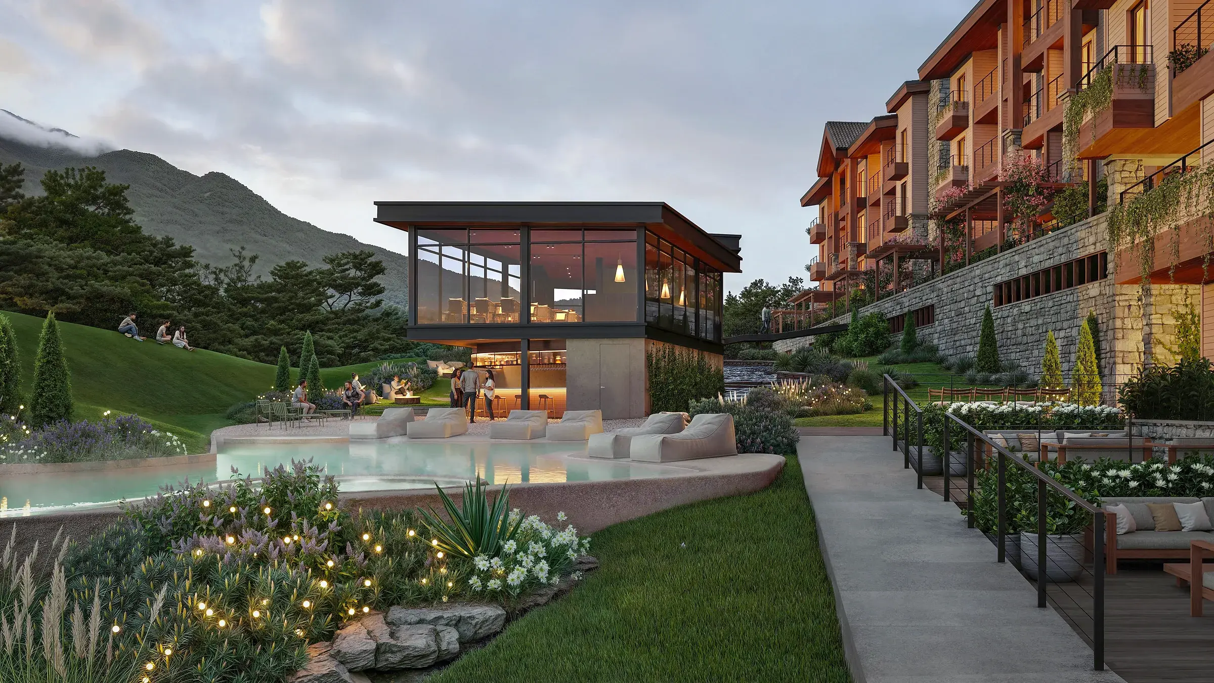 Architectural render of the Pinoalto Condo Suites lagoon-style pool at dusk, with bean-bag loungers, a glass-walled pavilion with a bar, and a timber-and-stone residential block beside a forested mountain.